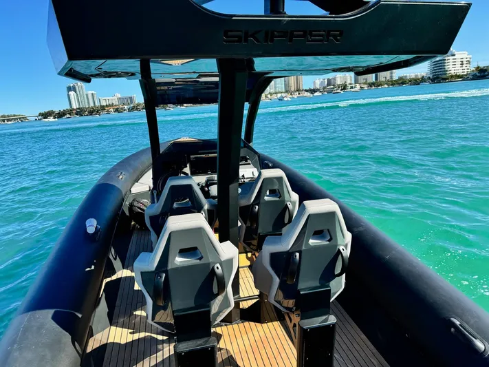2025 Skipper 34 Twin 300 V8 Yacht Photos Pics Skipper-BSK 34 boat, 2025 model, on turquoise water with modern seating.