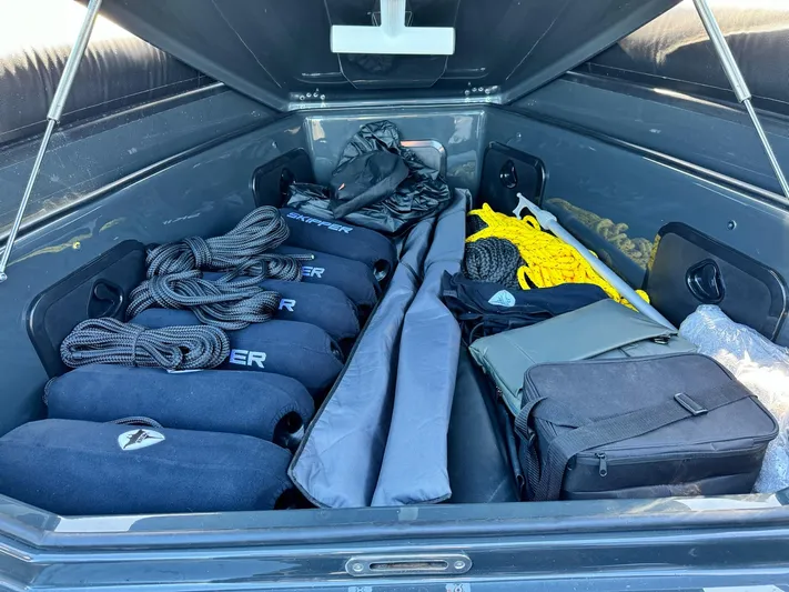 2025 Skipper 34 Twin 300 V8 Yacht Photos Pics Storage compartment of Skipper-BSK 34 boat, 2025 model, with organized gear and equipment.