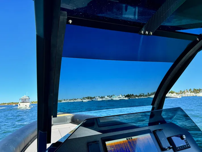 2025 Skipper 34 Twin 300 V8 Yacht Photos Pics Skipper-BSK 34 boat dashboard view, navigating clear blue waters, 2025 model.