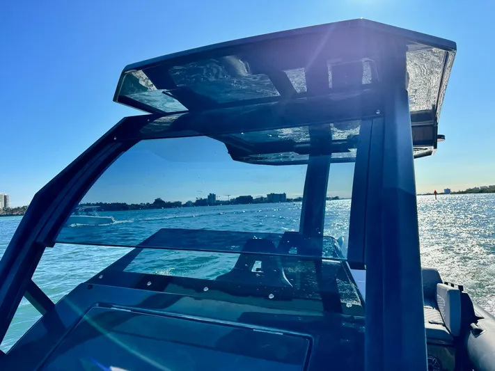 2025 Skipper 34 Twin 300 V8 Yacht Photos Pics 2025 Skipper-BSK 34 boat on water, sunny day, modern design, clear blue sky.