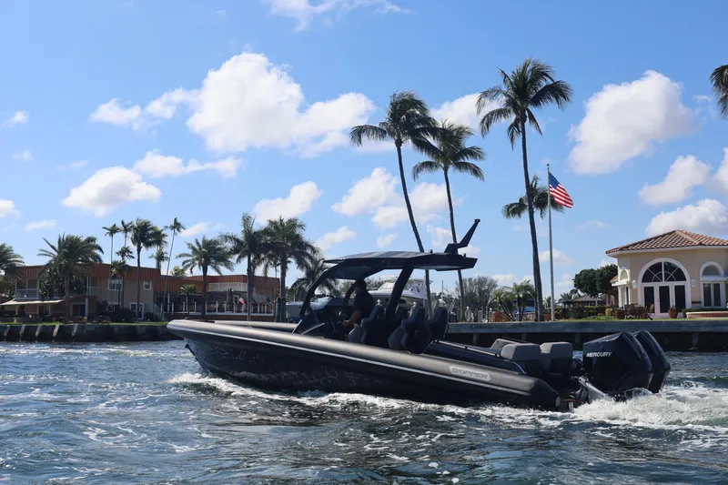 2025 Skipper 34 Twin 300 V8 Yacht Photos Pics 2025 Skipper-BSK 34 boat cruising near palm trees and waterfront homes.