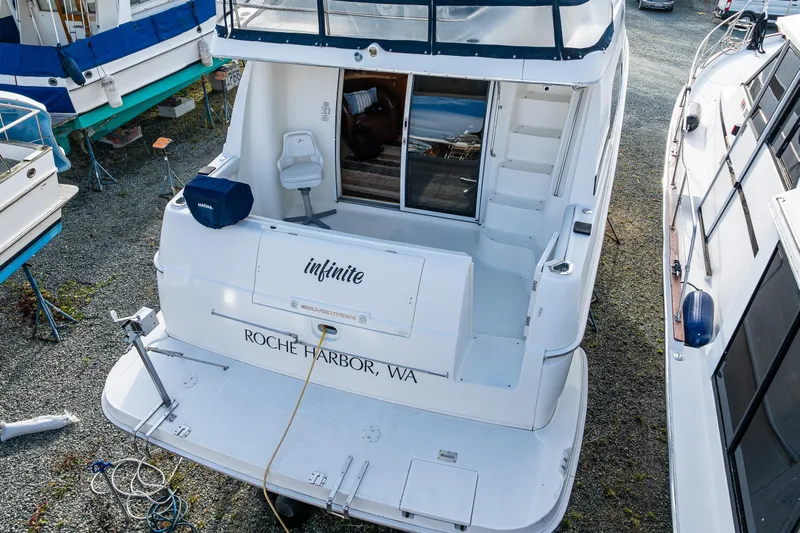 Infinite Yacht Photos Pics 2001 Silverton 410 Sport Bridge yacht docked at Roche Harbor, WA.