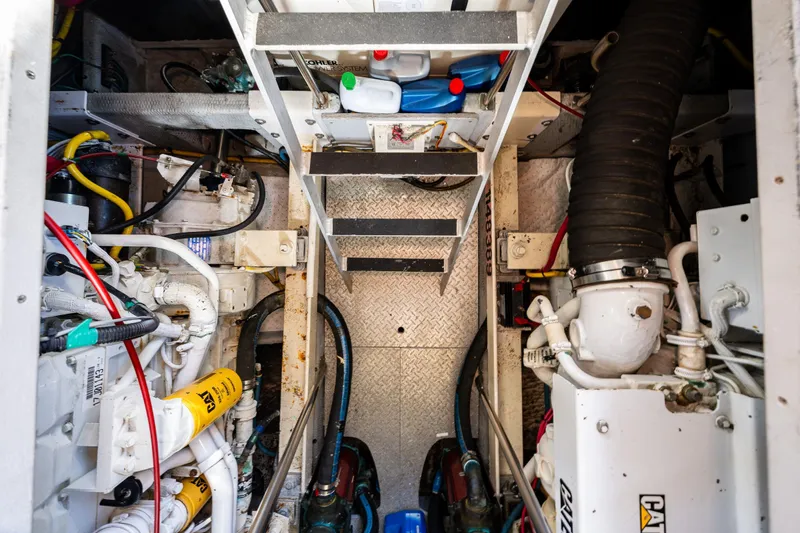 Infinite Yacht Photos Pics Engine room of 2001 Silverton 410 Sport Bridge with visible machinery and components.