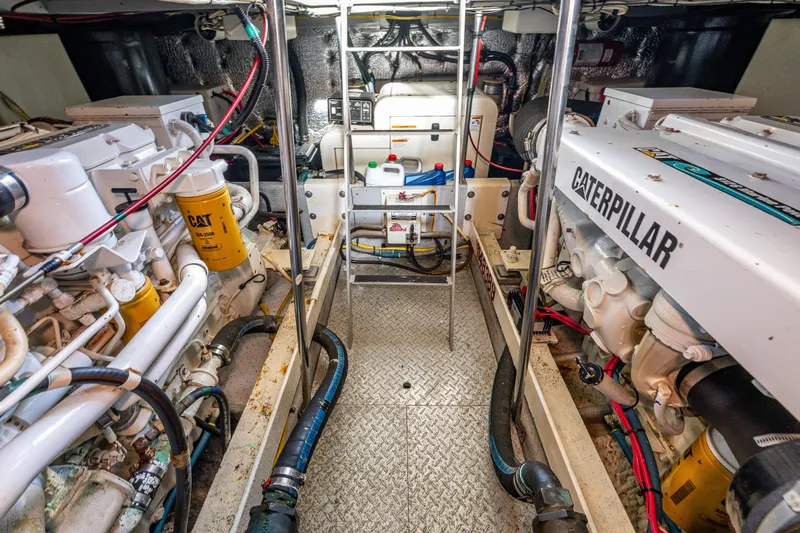 Infinite Yacht Photos Pics Engine room of 2001 Silverton 410 Sport Bridge with Caterpillar engines and equipment.