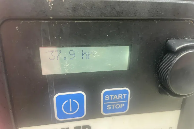  Yacht Photos Pics Control panel displaying 37.9 hours on a 2014 Cruisers Yachts 380 Express.