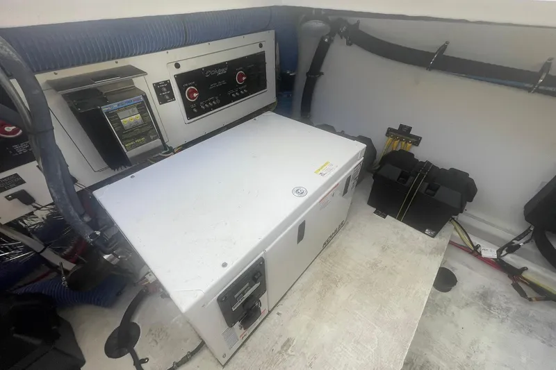  Yacht Photos Pics Engine room of 2014 Cruisers Yachts 380 Express with electrical components and generator.