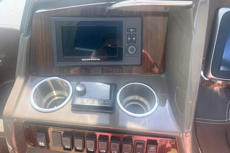  Yacht Photos Pics 2014 Cruisers Yachts 380 Express dashboard with Volvo Penta display and controls.