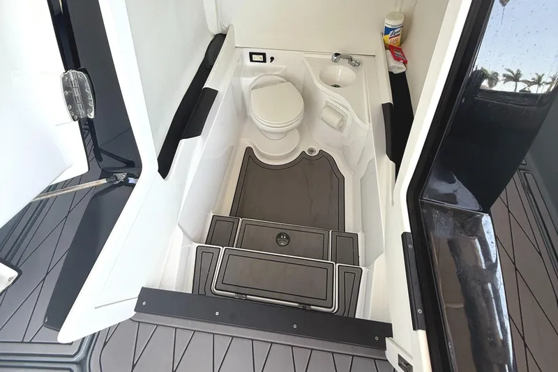  Yacht Photos Pics Compact bathroom in 2020 Statement 350 Open boat, featuring toilet and sink.