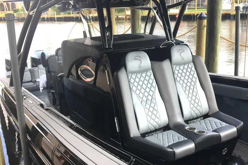  Yacht Photos Pics 2020 Statement 350 Open boat with luxurious seating and sleek design docked by the water.