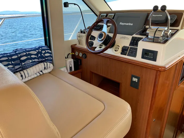 Live Now Yacht Photos Pics Interior of 2012 Silverton 33 Sport Coupe yacht with helm and navigation equipment.