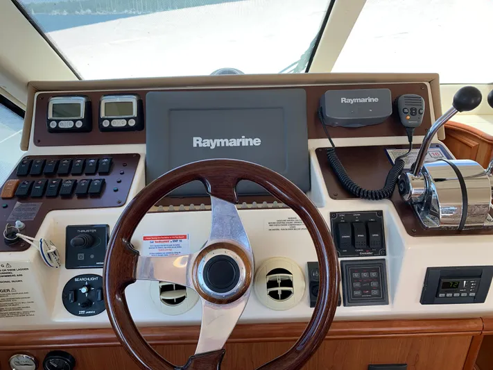 Live Now Yacht Photos Pics 2012 Silverton 33 Sport Coupe helm with Raymarine electronics and wooden steering wheel.