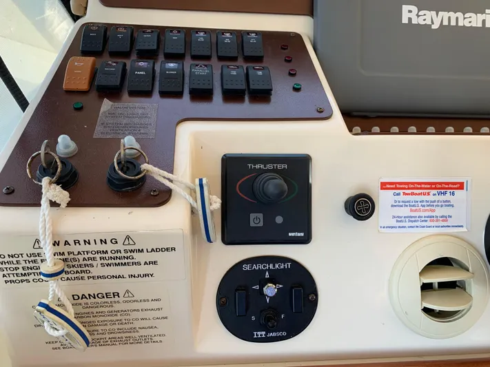 Live Now Yacht Photos Pics Control panel of a 2012 Silverton 33 Sport Coupe with switches and warning labels.