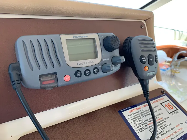 Live Now Yacht Photos Pics VHF radio system on 2012 Silverton 33 Sport Coupe boat dashboard.