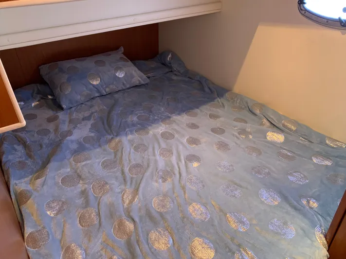 Live Now Yacht Photos Pics Cozy bed with blue polka dot bedding in 2012 Silverton 33 Sport Coupe cabin.