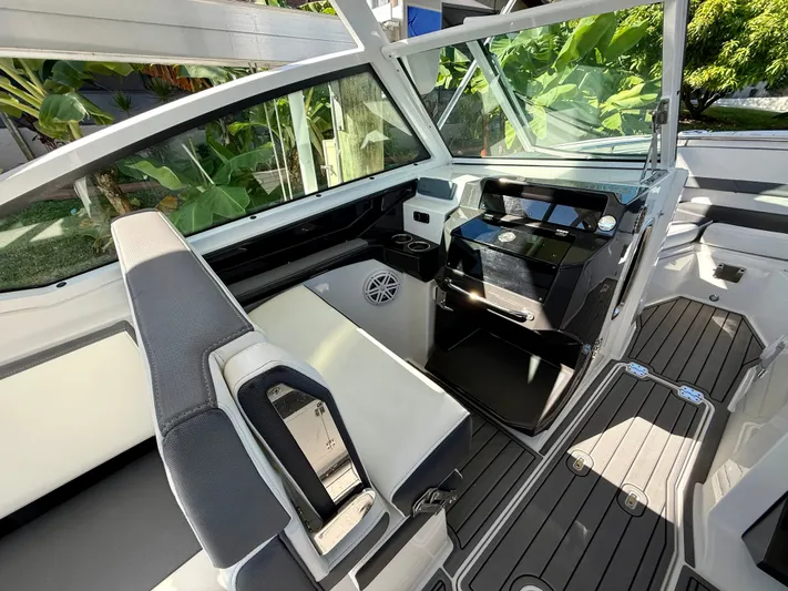  Yacht Photos Pics 2019 Blackfin 272 DC boat interior with sleek seating and modern dashboard design.