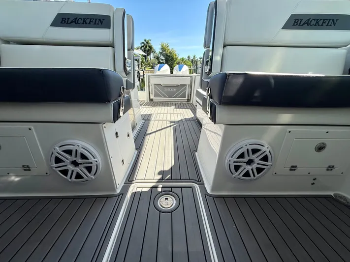 Yacht Photos Pics 2019 Blackfin 272 DC boat interior with seating and speakers on a sunny day.