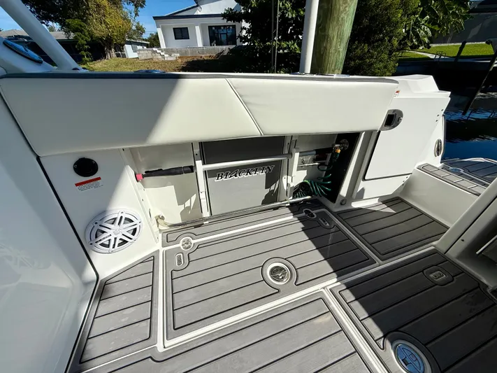  Yacht Photos Pics 2019 Blackfin 272 DC boat interior with deck, storage, and speaker.