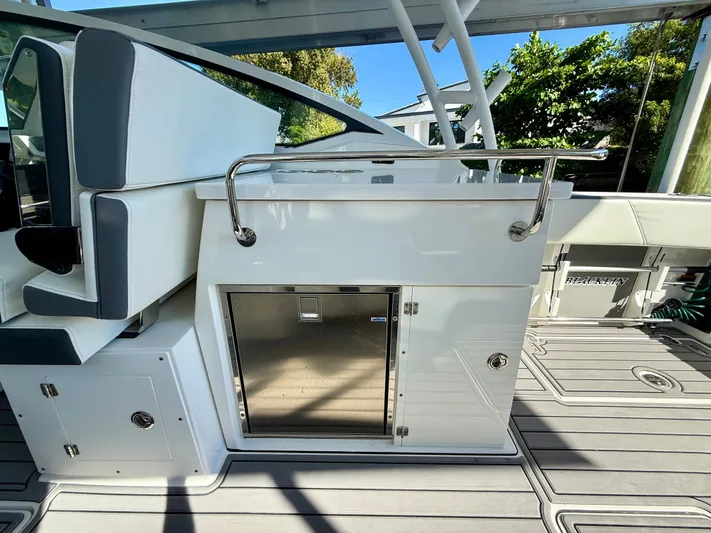  Yacht Photos Pics 2019 Blackfin 272 DC boat interior with seating and storage compartments.