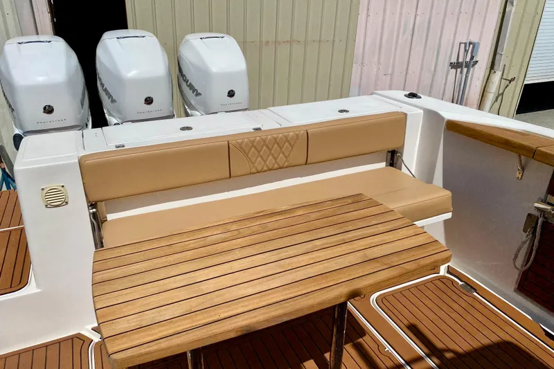  Yacht Photos Pics 2023 Fishing Raptor 390 Solarium boat with teak deck and cushioned seating.