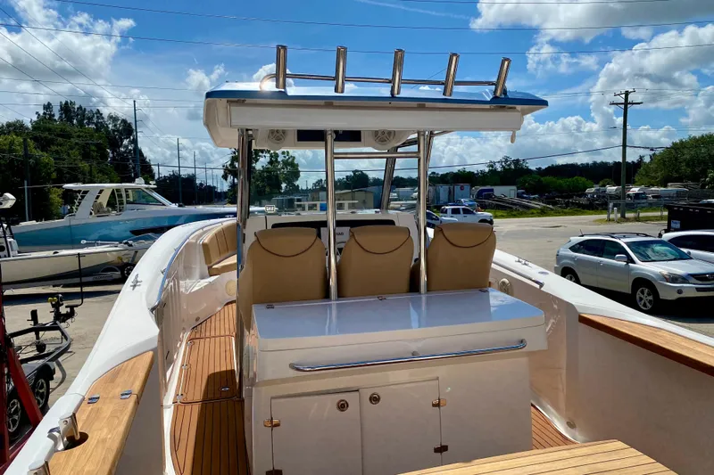  Yacht Photos Pics 2023 Fishing Raptor 390 Solarium boat with sleek design and comfortable seating.
