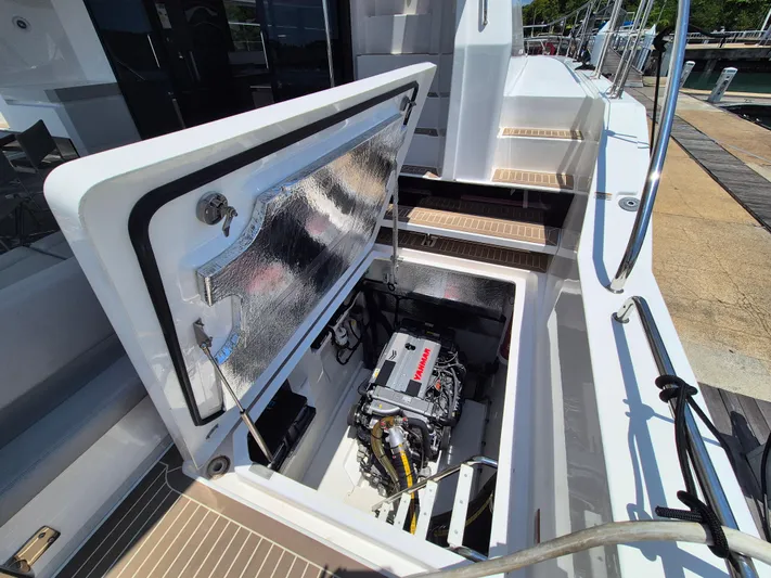  Yacht Photos Pics 2024 Leopard 53 Powercat engine compartment with open hatch, showcasing modern marine engineering.
