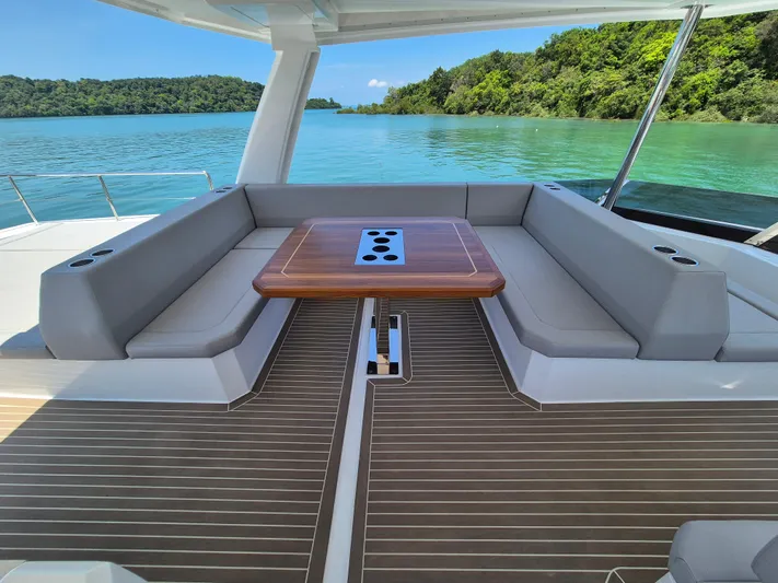  Yacht Photos Pics 2024 Leopard 53 Powercat yacht with spacious seating and scenic ocean view.