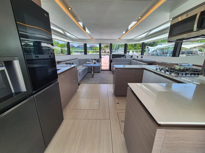  Yacht Photos Pics Luxurious interior of 2024 Leopard 53 Powercat yacht with modern kitchen and spacious seating area.