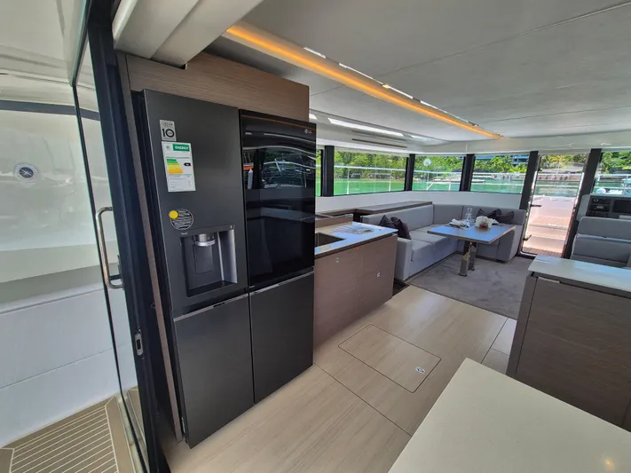  Yacht Photos Pics Luxurious interior of 2024 Leopard 53 Powercat yacht with modern kitchen and spacious seating area.