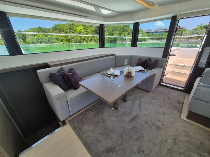  Yacht Photos Pics Luxurious interior of 2024 Leopard 53 Powercat with elegant dining area and scenic views.