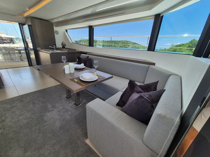  Yacht Photos Pics Luxurious interior of 2024 Leopard 53 Powercat yacht with elegant dining area and scenic views.