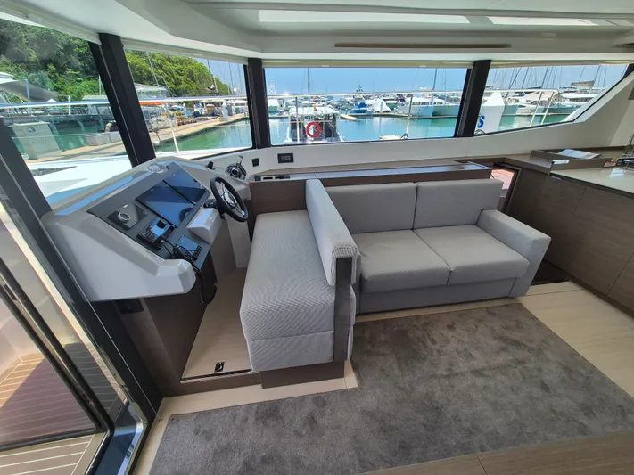  Yacht Photos Pics Interior of 2024 Leopard 53 Powercat yacht with modern helm and seating area.