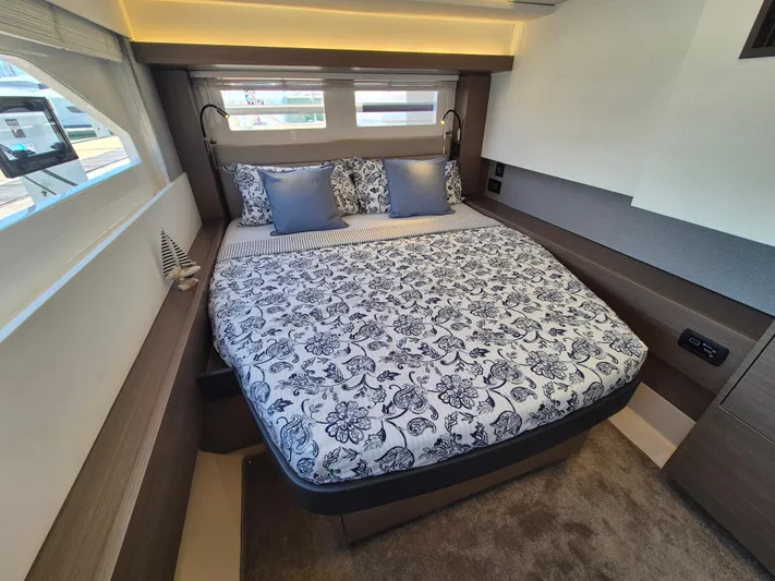  Yacht Photos Pics Luxurious bedroom interior of 2024 Leopard 53 Powercat with elegant bedding and modern design.