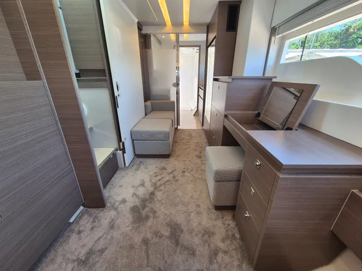  Yacht Photos Pics Luxurious interior of 2024 Leopard 53 Powercat, featuring modern wood finishes and plush carpeting.