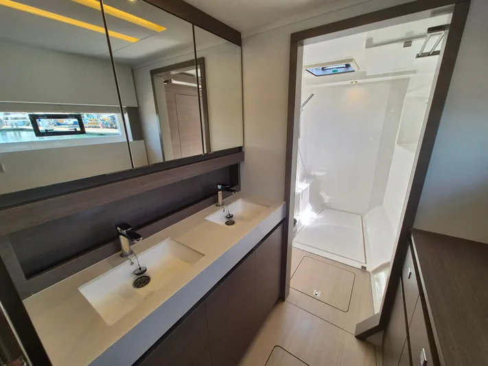  Yacht Photos Pics Luxurious bathroom in 2024 Leopard 53 Powercat with dual sinks and modern shower.