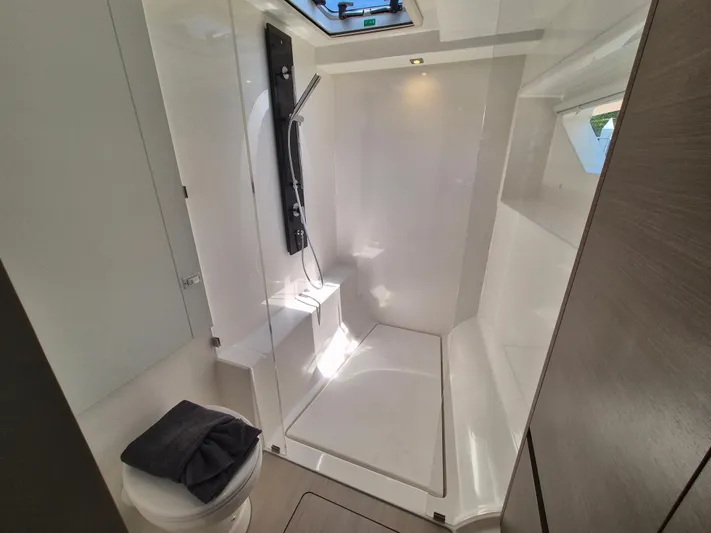  Yacht Photos Pics Bathroom interior of 2024 Leopard 53 Powercat, featuring modern shower and toilet.