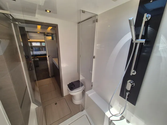  Yacht Photos Pics 2024 Leopard 53 Powercat bathroom with modern shower and sleek design.