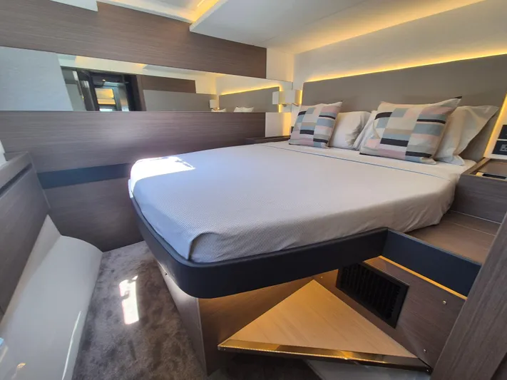  Yacht Photos Pics Luxurious bedroom interior of 2024 Leopard 53 Powercat yacht with modern design and ambient lighting.