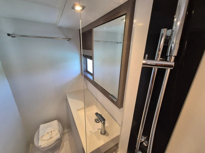  Yacht Photos Pics Modern bathroom interior of 2024 Leopard 53 Powercat yacht, featuring sleek fixtures and elegant design.