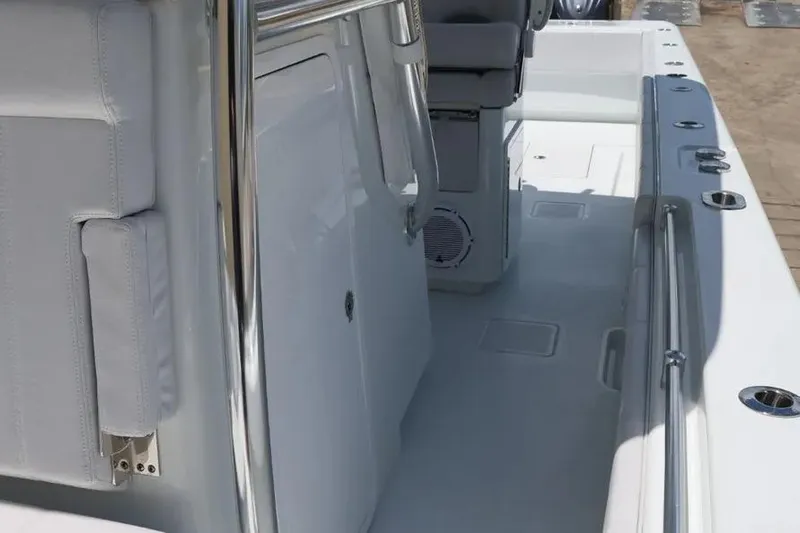  Yacht Photos Pics 2025 Contender 39 ST boat interior with sleek white seating and stainless steel railings.
