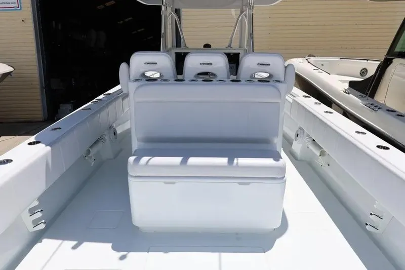  Yacht Photos Pics 2025 Contender 39 ST boat interior with white seating and console.