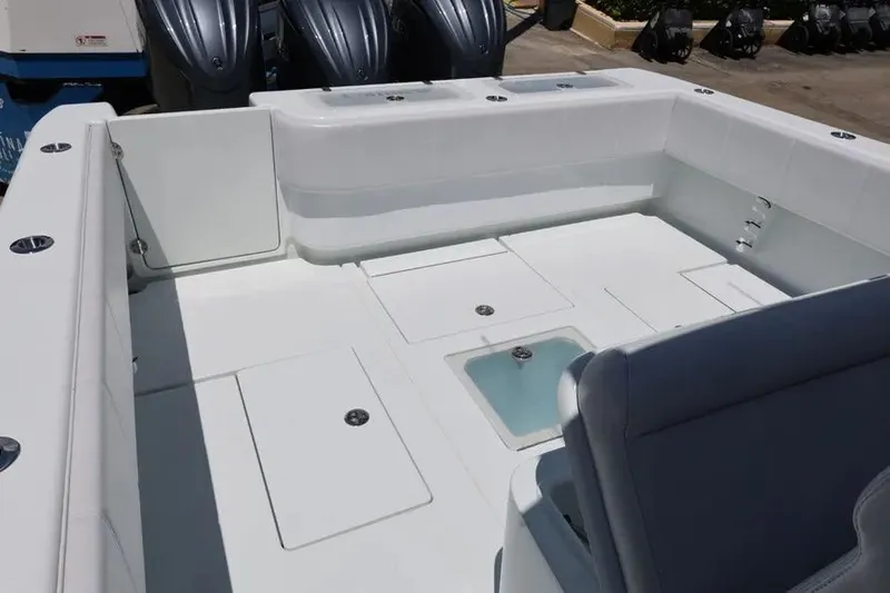  Yacht Photos Pics 2025 Contender 39 ST boat deck with storage compartments and seating.