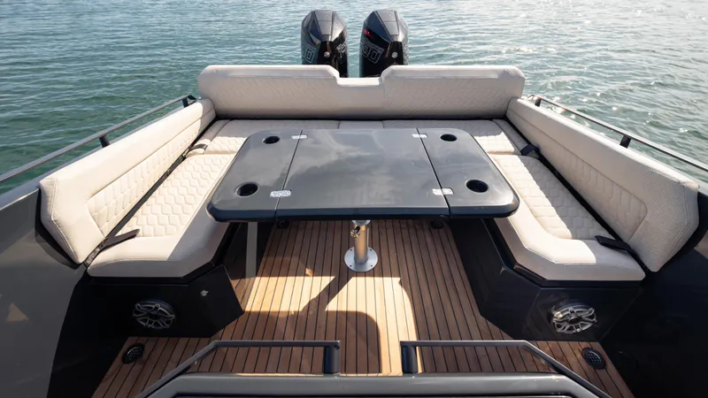 New 2025 Skipper 38 Twin 500 Yacht Photos Pics Luxurious 2025 Skipper-BSK 38 boat interior with cushioned seating and table on deck.