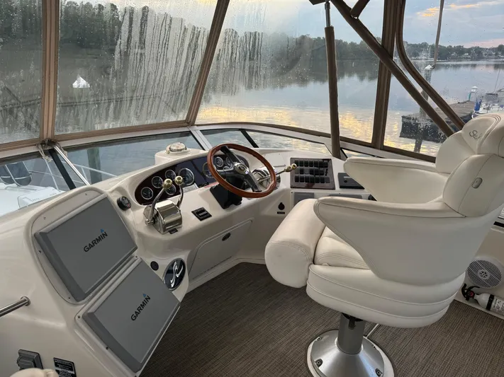 Messing About Yacht Photos Pics Interior helm of 2003 Sea Ray 400 Sedan Bridge with Garmin navigation systems.