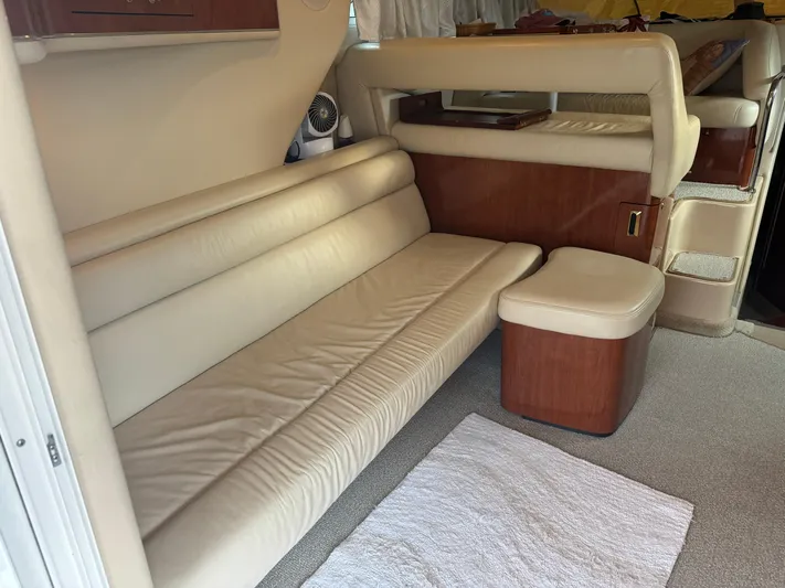Messing About Yacht Photos Pics 2003 Sea Ray 400 Sedan Bridge interior with beige leather seating and wooden accents.