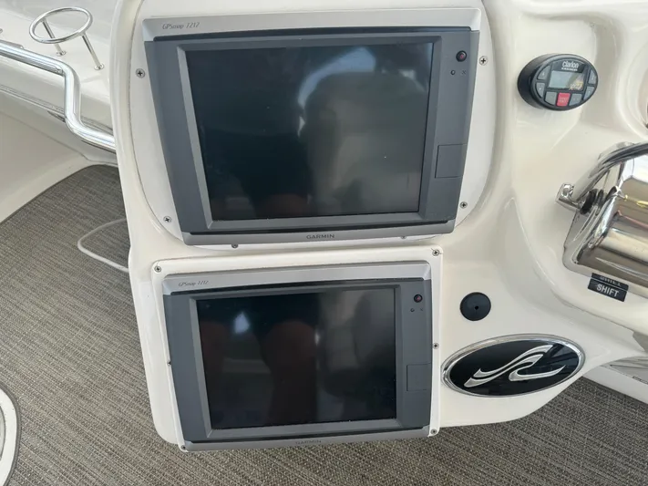 Messing About Yacht Photos Pics Control panel of 2003 Sea Ray 400 Sedan Bridge with dual navigation screens.