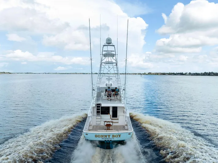 Sonny Boy Yacht Photos Pics 2004 Bertram 570 yacht cruising on open water under a partly cloudy sky.