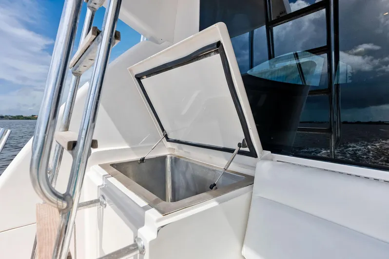 Sonny Boy Yacht Photos Pics Open storage compartment on 2004 Bertram 570 yacht, with stainless steel interior and ocean view.
