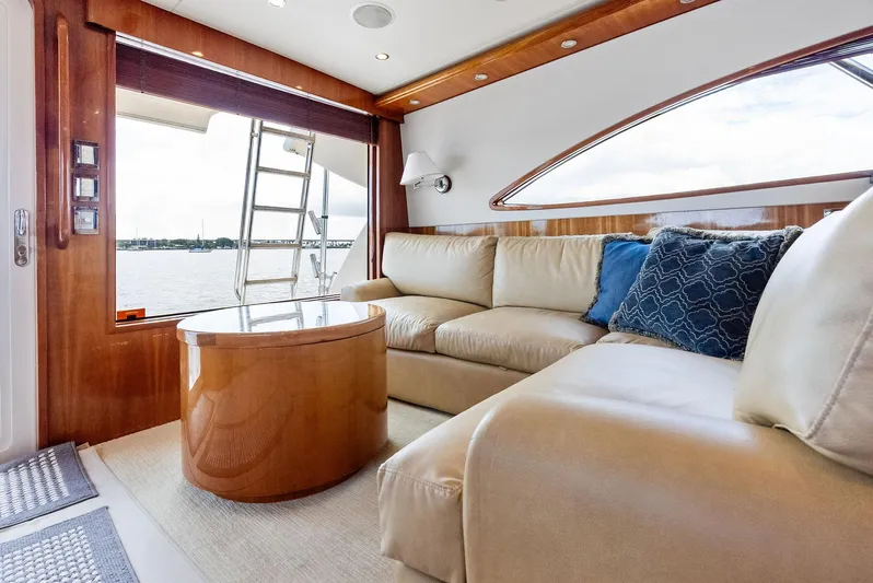 Sonny Boy Yacht Photos Pics Luxurious interior of 2004 Bertram 570 yacht with plush seating and elegant wood finishes.