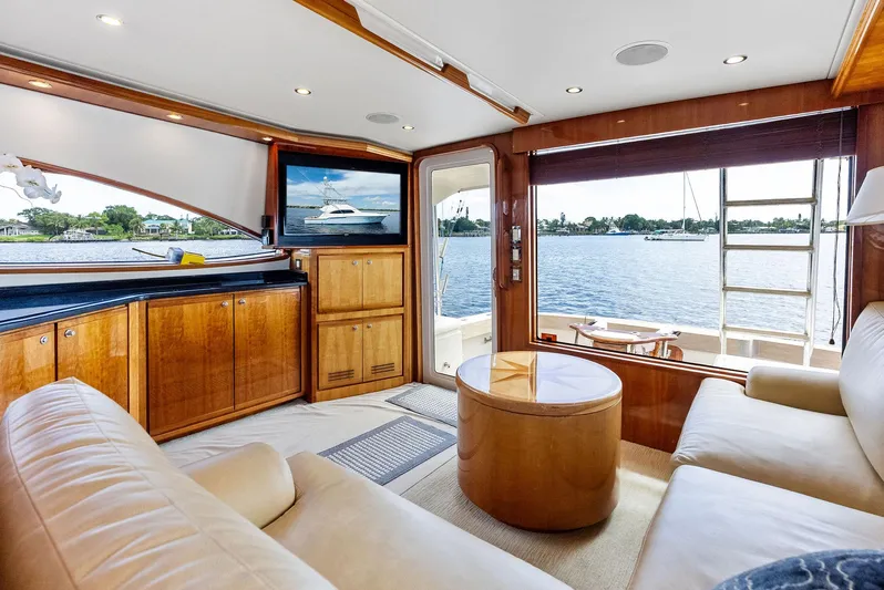 Sonny Boy Yacht Photos Pics Luxurious interior of 2004 Bertram 570 yacht with leather seating and waterfront view.