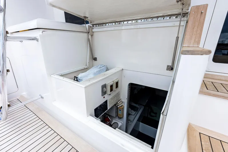 Sonny Boy Yacht Photos Pics 2004 Bertram 570 yacht engine compartment with open hatch and visible controls.